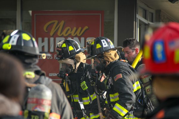 Firemen reporting to a local fire used for an article about fire line analysis by Apex Underground.
